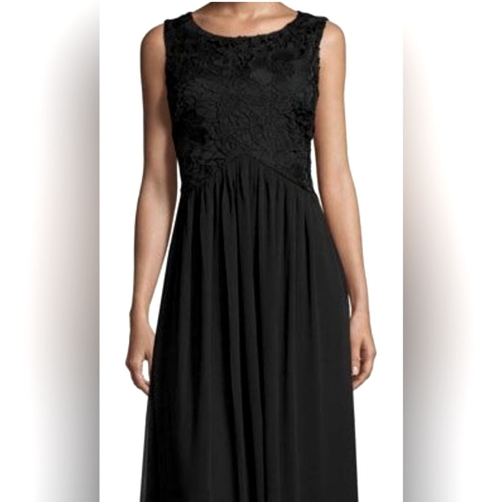 Lace bodice black dress with a chiffon skirt  and empire waist. Lined. Size 8